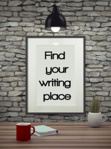 Inspirational quote on picture frame over a dirty brick wall. FIND YOUR WRITING PLACE